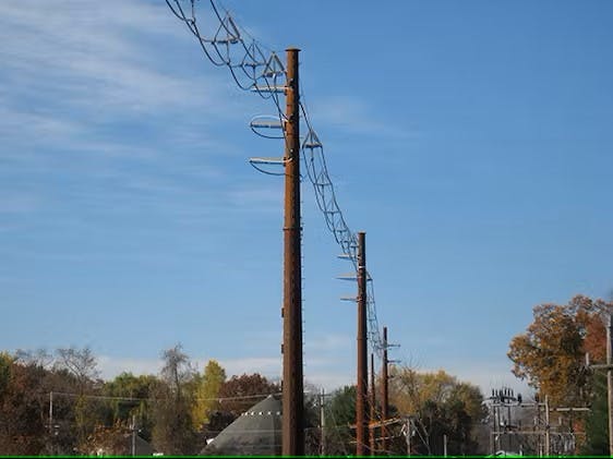 The 69-kV spacer cable was installed through dead-end structures with each phased dead-ended with jumpers around the structure.
