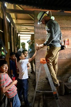 Billy Patterson, lineman at CKenergy Electric Cooperative from Binger, Oklahoma, had several young helpers as he wired homes. Billy Patterson, lineman at CKenergy Electric Cooperative from Binger, Oklahoma, had several young helpers as he wired homes.