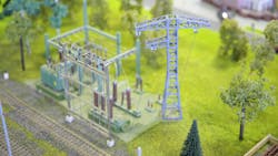 A model of an electrical substation. Net zero or real zero energy by 2050 has dramatic implications on the current planning, design, operations and maintenance of the electric transmission and distribution grid that delivers that energy. A model of an electrical substation. Net zero or real zero energy by 2050 has dramatic implications on the current planning, design, operations and maintenance of the electric transmission and distribution grid that delivers that energy.