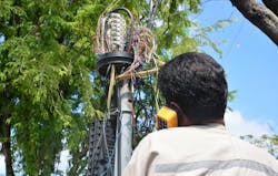A technician plugs a network cable into a line socket. A robust, private broadband network will help electric utilities build and maintain a real zero T&D grid in the years approaching 2050. A technician plugs a network cable into a line socket. A robust, private broadband network will help electric utilities build and maintain a real zero T&D grid in the years approaching 2050.