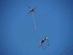 Utility lineworkers utilize the Mini LineFly™ to install PLP BIRD-FLIGHT™ Diverters on overhead power lines. Utility lineworkers utilize the Mini LineFly™ to install PLP BIRD-FLIGHT™ Diverters on overhead power lines.