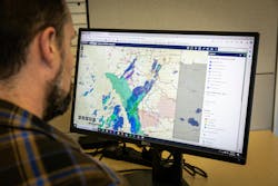 FortisAlberta employee scanning the company&rsquo;s proprietary wildfire electronic mapping application.