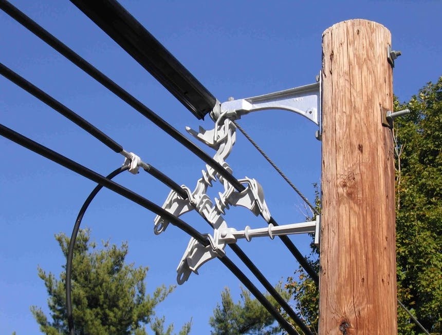 Spacer cable system.