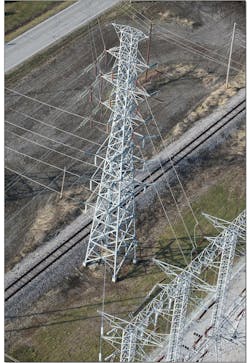 Prior to the the project, a single lattice tower supported five transmission circuits. Photo by Ameren Illinois. Prior to the the project, a single lattice tower supported five transmission circuits. Photo by Ameren Illinois.