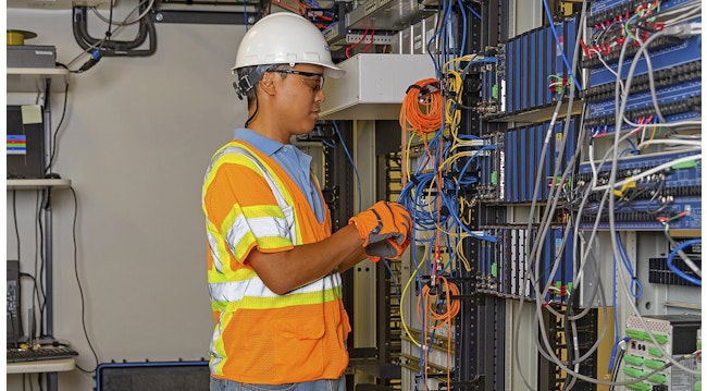 newengineer_checking_wires_in_lab