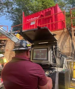 Chad Cox from Brent Scarbrough &amp; Company (BCS), Newnan, GA, monitors the hydraulic pressures and drill head orientation on the operator&rsquo;s console of the Barbco Pathfinder 500.