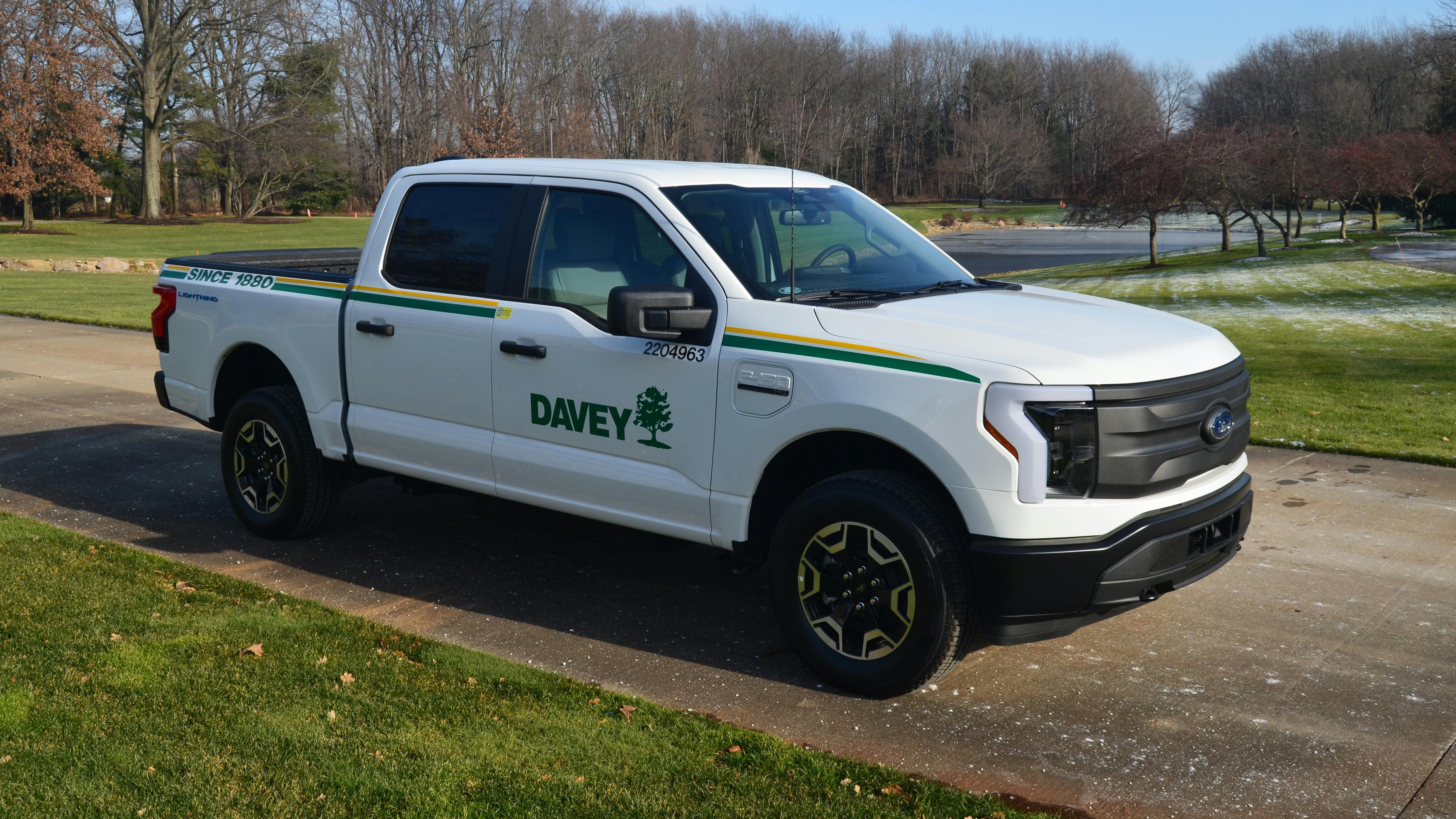 Davey Tree employees drive Ford F-150 Lightning trucks.