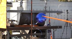 A mylar balloon is made to contact live equipment in a test of a rapid earth fault current limiter. Photo by SCE