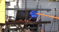 A mylar balloon is made to contact live equipment in a test of a rapid earth fault current limiter. Photo by SCE A mylar balloon is made to contact live equipment in a test of a rapid earth fault current limiter. Photo by SCE