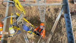 Melissa Dawe, a fourth-year apprentice with Connect Atlantic Utility Services, re-insulates a 345 kV line. Melissa Dawe, a fourth-year apprentice with Connect Atlantic Utility Services, re-insulates a 345 kV line.