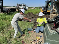 Figure 2 Summer intern Tayden Wells Hake learns by doing from UCEC journeyman line worker Brandon Warnke, on a deenergized junction box a common piece of equipment on UCEC’s system. Figure 2 Summer intern Tayden Wells Hake learns by doing from UCEC journeyman line worker Brandon Warnke, on a deenergized junction box a common piece of equipment on UCEC’s system.