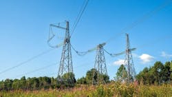 View of fragment of power line as component of large electrical networks and system of power equipment. Electricity transmission, electric current. Energy supply of regions. Selective focus. View of fragment of power line as component of large electrical networks and system of power equipment. Electricity transmission, electric current. Energy supply of regions. Selective focus.