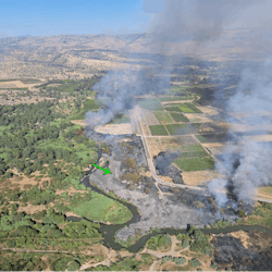 Firefighter plane photo of the burned area. Arrow marks power tower #5 Firefighter plane photo of the burned area. Arrow marks power tower #5