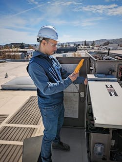 Edo engineer testing performance and connectivity on rooftop unit (HVAC) at Seattle’s McKinstry Innovation Center building. Edo engineer testing performance and connectivity on rooftop unit (HVAC) at Seattle’s McKinstry Innovation Center building.