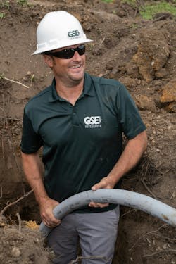 Erik Mollerberg, lead operations manager for GSE Integrated, installs the conduit used to protect and route the electrical wiring for the EV charging stations. Erik Mollerberg, lead operations manager for GSE Integrated, installs the conduit used to protect and route the electrical wiring for the EV charging stations.