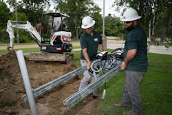 GSE Integrated employees, Erik Mollerberg (left), lead operations manager, and Kenneth Stephenson, service technician, setup the EV charging station framing equipment. GSE Integrated employees, Erik Mollerberg (left), lead operations manager, and Kenneth Stephenson, service technician, setup the EV charging station framing equipment.