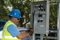 Kevin Bono, Cleco Power’s supervisor of distribution construction, marks the underground service at the EV meter center with colored tape. This tape matches the underground riser, allowing for quick identification and troubleshooting in the future if needed. Kevin Bono, Cleco Power’s supervisor of distribution construction, marks the underground service at the EV meter center with colored tape. This tape matches the underground riser, allowing for quick identification and troubleshooting in the future if needed.