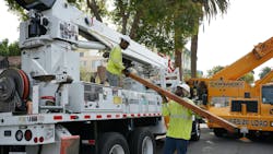 Donald Boyd (left), SCE groundman and 2023 Lineworker Scholarship recipient, and Nathan A. Griffith (right), SCE lineworker, prepare materials to build a crossarm in West Hollywood, California. Donald Boyd (left), SCE groundman and 2023 Lineworker Scholarship recipient, and Nathan A. Griffith (right), SCE lineworker, prepare materials to build a crossarm in West Hollywood, California.