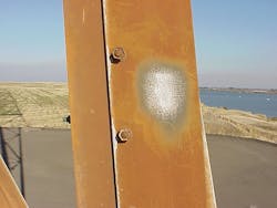 Weathered galvanizing. The zinc remains intact beneath the reddish-brown staining. Weathered galvanizing. The zinc remains intact beneath the reddish-brown staining.