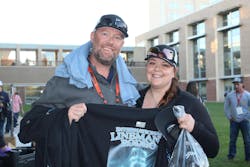 Chris Holub and Chenya Cochran from Mass Electric Construction Co. showed off their limited-edition T-shirts with a glowing blue design. Chris Holub and Chenya Cochran from Mass Electric Construction Co. showed off their limited-edition T-shirts with a glowing blue design.