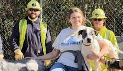 Corey Black, lineman, Alex Menke, kennel manager of Peoria County Animal Protection Services, and Steve Freeman, lineman, pose with one of the rescue dogs. Corey Black, lineman, Alex Menke, kennel manager of Peoria County Animal Protection Services, and Steve Freeman, lineman, pose with one of the rescue dogs.