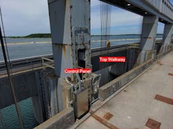 This close-up of the top walkway and gentry crane is from Long Sault Dam in the St. Lawrence hydro power project. This close-up of the top walkway and gentry crane is from Long Sault Dam in the St. Lawrence hydro power project.