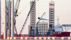 Offshore wind turbine parts being loaded onto supply vessel in the UK. Offshore wind turbine parts being loaded onto supply vessel in the UK.