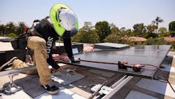 Installing rooftop solar panel. Installing rooftop solar panel.