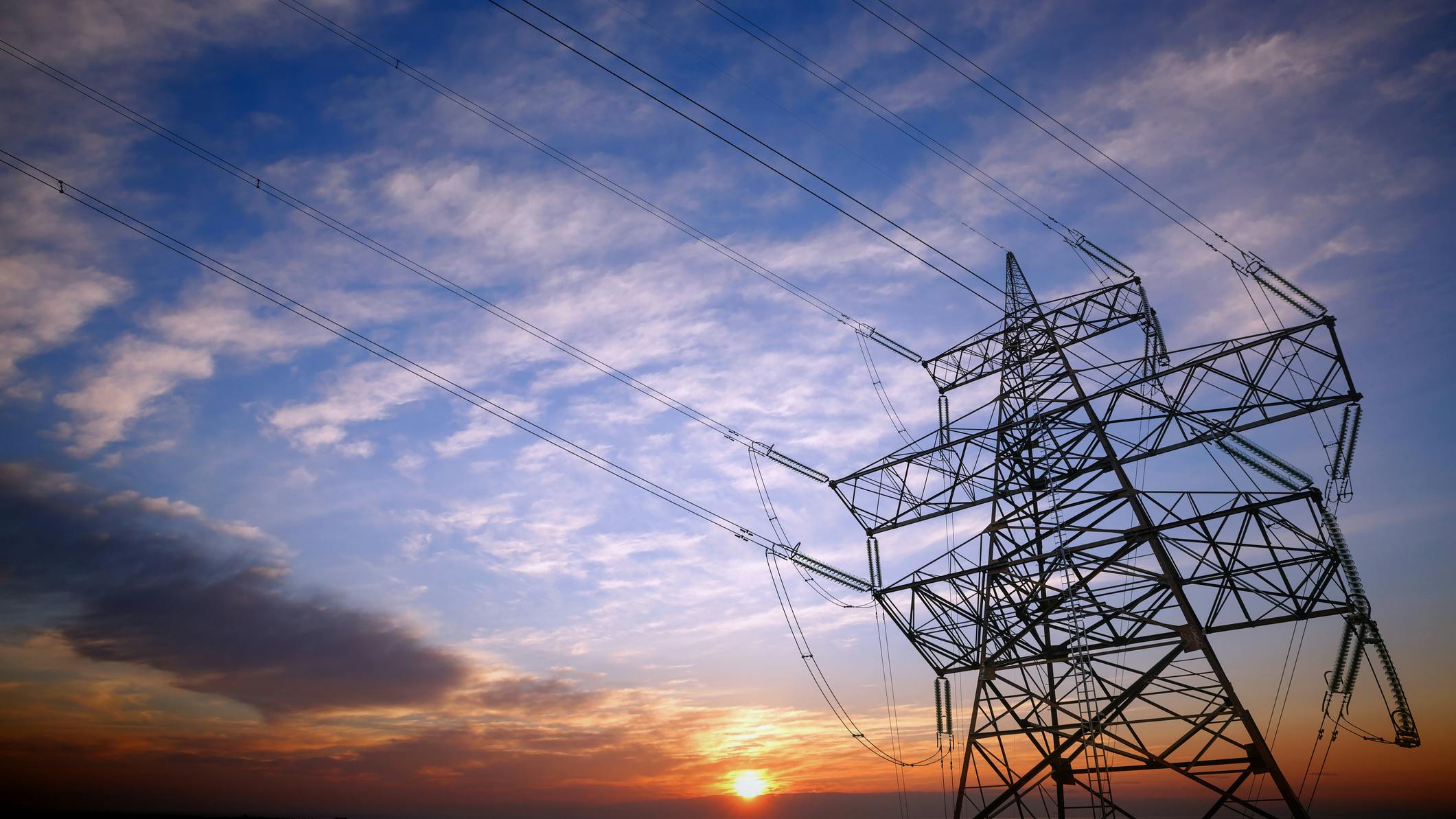 transmission tower and sunset