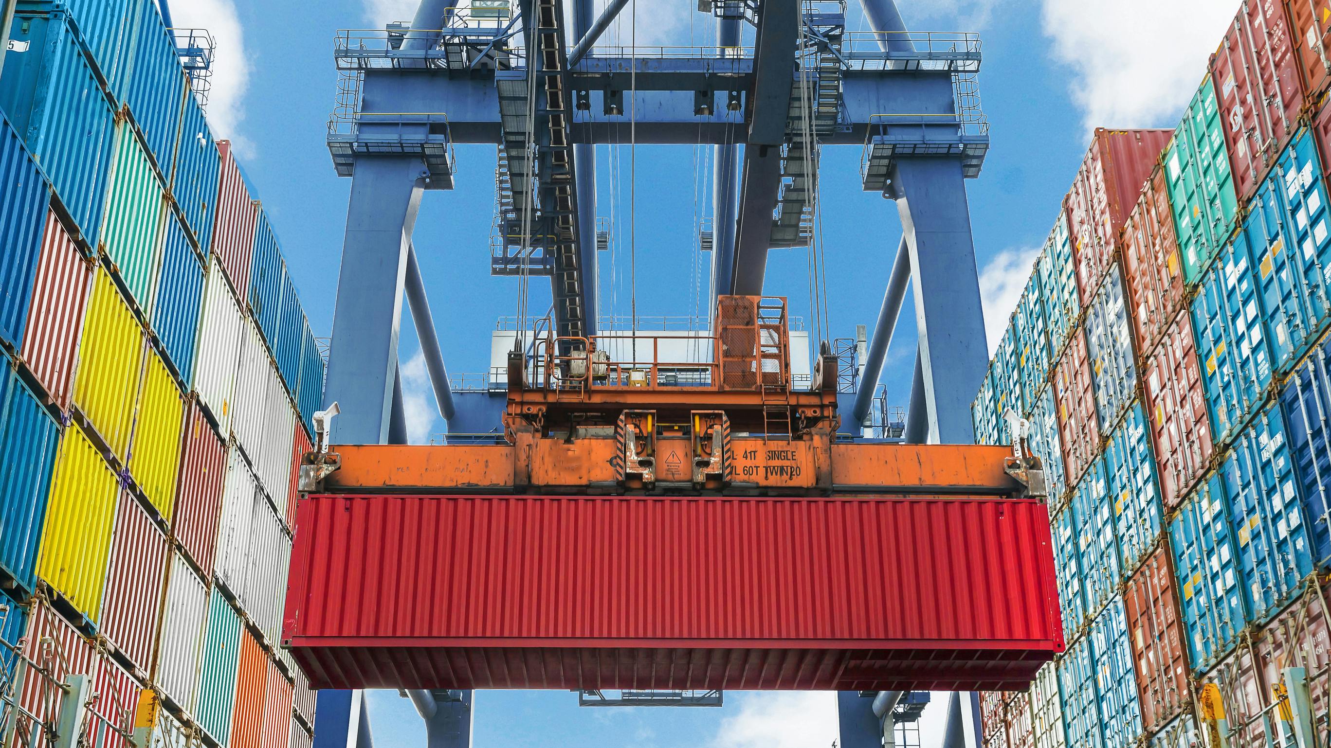 A port crane lifts a modular container into place. Cyber vulnerabilities cropped up in the systems that operate these cranes.