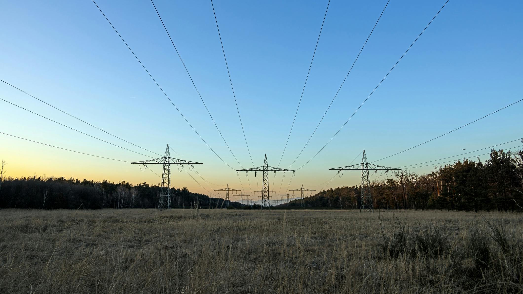 power lines with towers in distance
