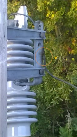 RFIPic4: Look closely and you can see the white arc between the high voltage jumper wire and the steel cutout bracket. This was discovered during an RFI investigation, and it resulted in a quick and easy repair. RFIPic4: Look closely and you can see the white arc between the high voltage jumper wire and the steel cutout bracket. This was discovered during an RFI investigation, and it resulted in a quick and easy repair.