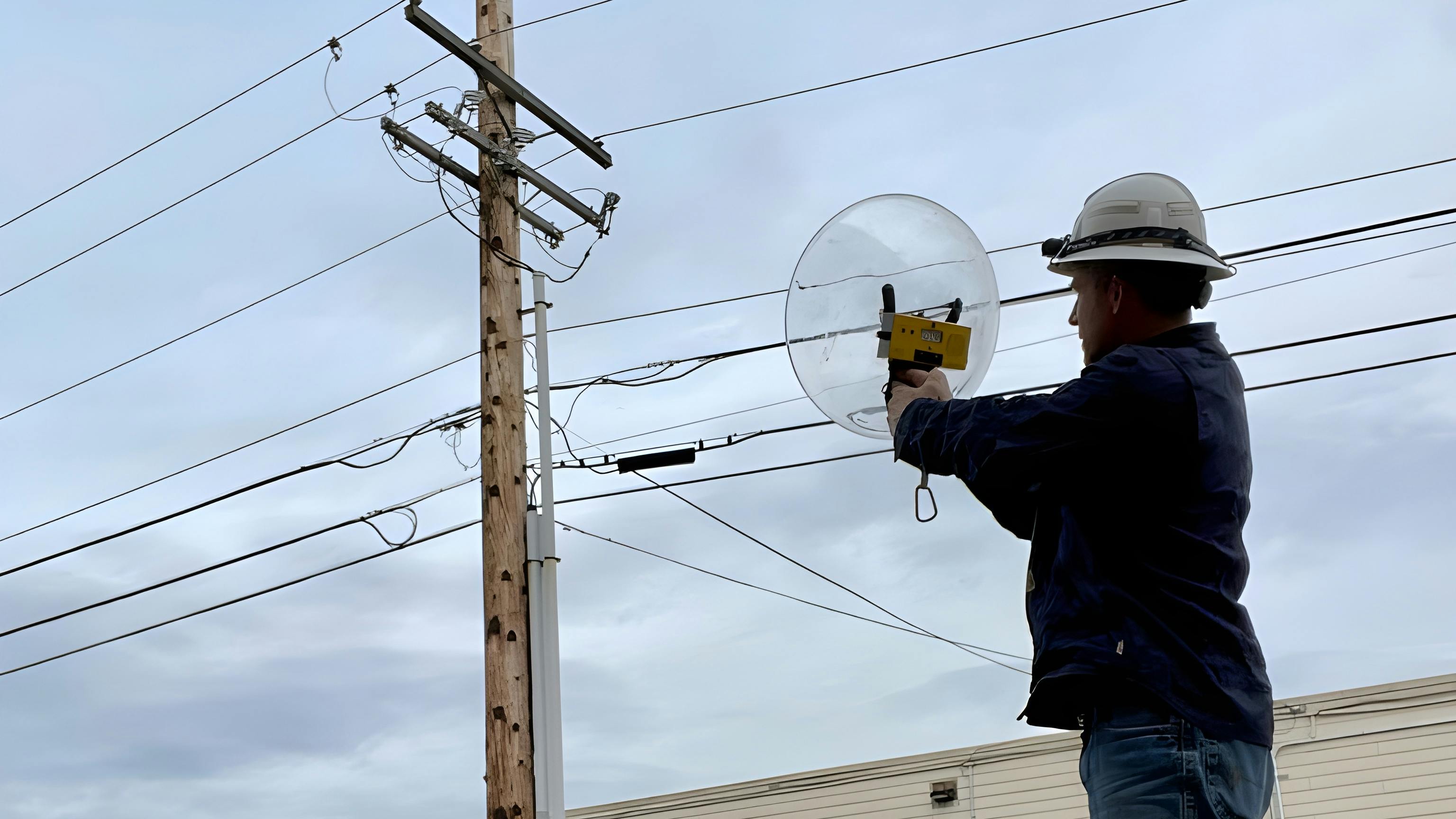 Jon Backman uses the Radar Engineers Parabolic Pinpointer to identify the RFI location on a pole.