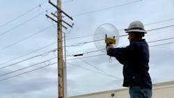 Jon Backman uses the Radar Engineers Parabolic Pinpointer to identify the RFI location on a pole. Jon Backman uses the Radar Engineers Parabolic Pinpointer to identify the RFI location on a pole.