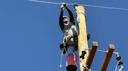 Logan Pollei, an apprentice for Duke Energy, removes the preform from the line to complete this step in the second mystery event at the 2024 International Lineman’s Rodeo.