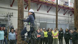 Andrea Simmons, ComEd crew leader, demonstrates how to climb a utility pole to participants of a March 2025 Women’s Climb Clinic for a first-hand look at what it takes to join the electrical trades. Andrea Simmons, ComEd crew leader, demonstrates how to climb a utility pole to participants of a March 2025 Women’s Climb Clinic for a first-hand look at what it takes to join the electrical trades.