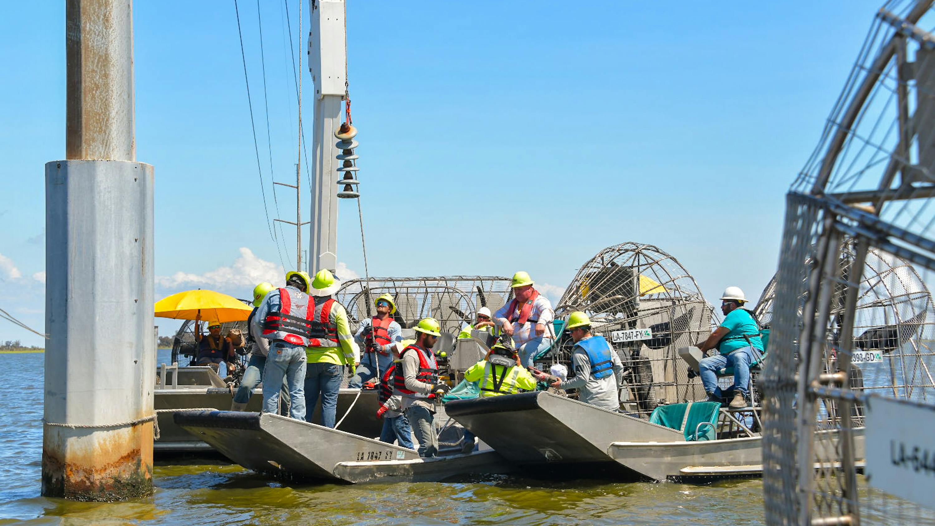 Entergy workers and contractors face a variety of terrain challenges when restoring power after storms, like these lineworkers who used airboats to access transmission infrastructure damaged by Hurricane Francine.