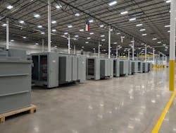 Liquid-filled transformers on an MGM Transformers factory floor. Liquid-filled transformers on an MGM Transformers factory floor.