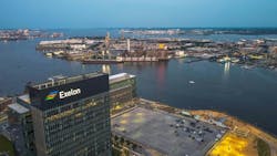 An aerial View of Exelon building with parking lot and Baltimore Harbor behind it in the United States An aerial View of Exelon building with parking lot and Baltimore Harbor behind it in the United States