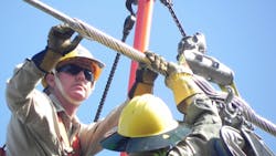 workers upgrading transmission line workers upgrading transmission line