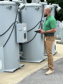Joe Skelton, Director of Operations at UCEMC, collects field data from a voltage regulator for input into the asset management system. Joe Skelton, Director of Operations at UCEMC, collects field data from a voltage regulator for input into the asset management system.