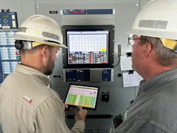 UCEMC substation technicians Zach Wilken (left) and Garry Loftis (right) inside a substation control house gathering substation data for monthly reports. UCEMC substation technicians Zach Wilken (left) and Garry Loftis (right) inside a substation control house gathering substation data for monthly reports.