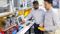 Prasad Kandula and Marcio Magri Kimpara set up testing of ORNL-developed medium-voltage circuit breakers that use affordable semiconductors to protect grid systems that use direct current. Prasad Kandula and Marcio Magri Kimpara set up testing of ORNL-developed medium-voltage circuit breakers that use affordable semiconductors to protect grid systems that use direct current.