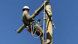 Kellen Miller, shown handling a crossarm during pole-top training, graduated from DMACC’s Electric Utility Technology Program, where he learned the skills of the line trade. Kellen Miller, shown handling a crossarm during pole-top training, graduated from DMACC’s Electric Utility Technology Program, where he learned the skills of the line trade.