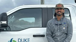 man in front of utility truck man in front of utility truck