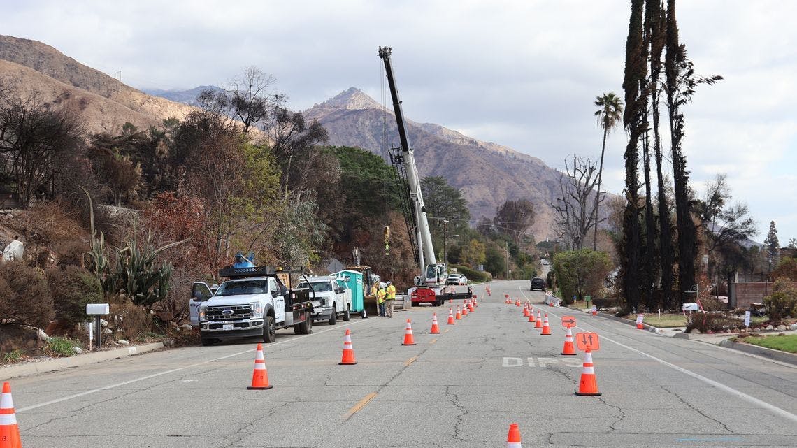utility crews working on underground power line
