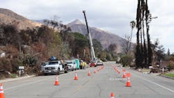 utility crews working on underground power line utility crews working on underground power line