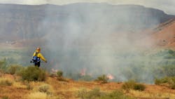 Firemen watch over a prescribed burn Firemen watch over a prescribed burn