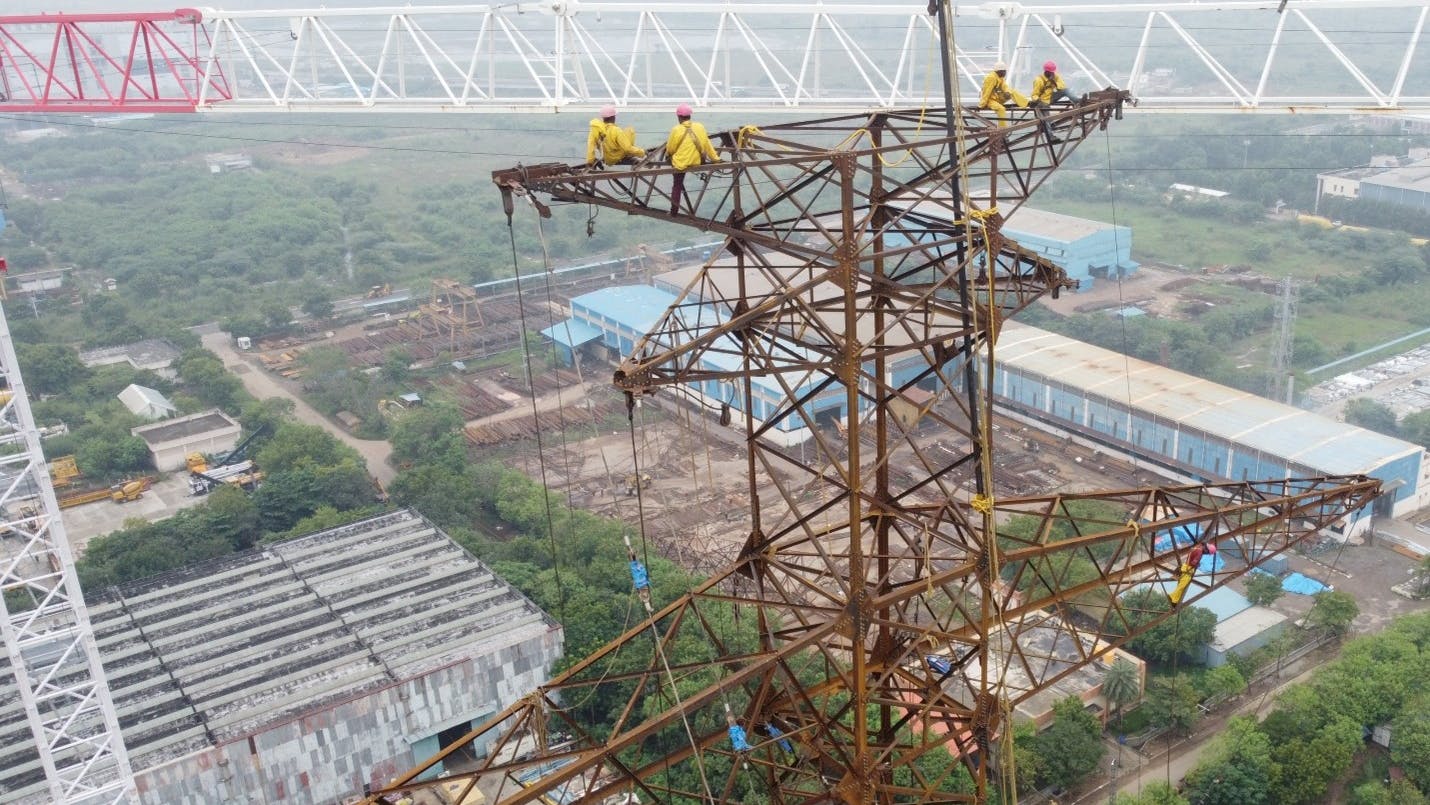 Crews atop the tallest tower