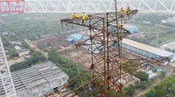 Crews atop the tallest tower Crews atop the tallest tower